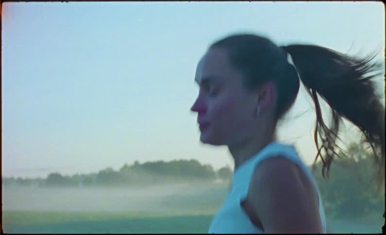 Young fit woman jogging on the countryside at morning