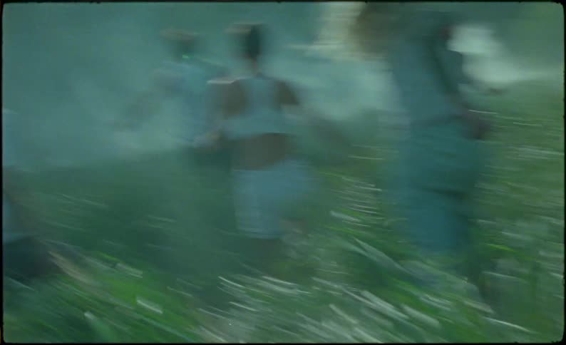A group of teenagers run towards the smoke