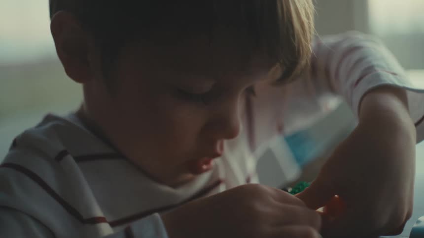 A child is building with legos