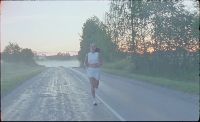 A woman is running down the road