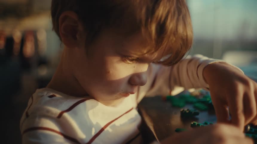 Boy playing alone at home in the morning
