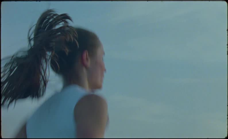 Young fit woman jogging on the countryside at morning