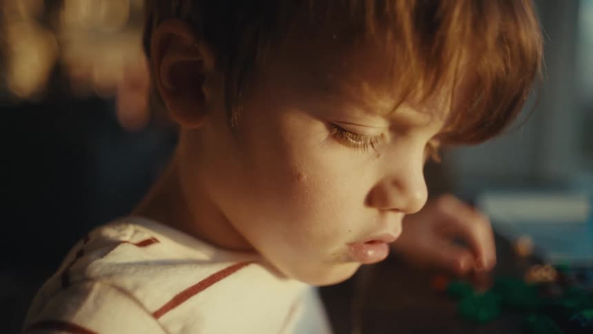 Closeup of a boys face bathed in sunlight