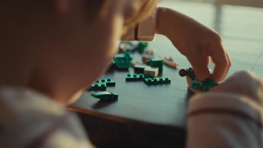 Boy playing alone at home in the morning