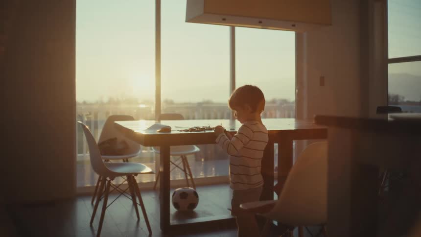 Boy playing alone at home in the morning