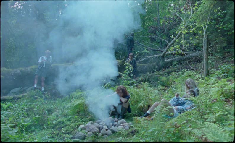 Teenagers are camping in the woods