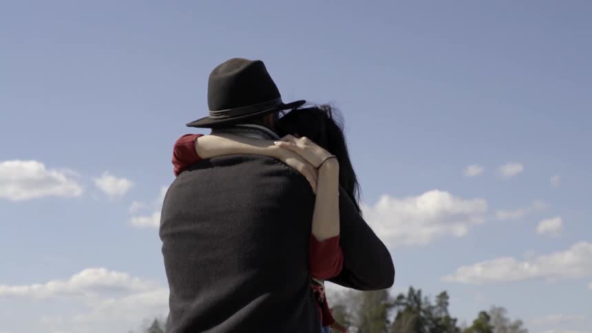 a romantic couple sharing a tender moment together in the sunlight.