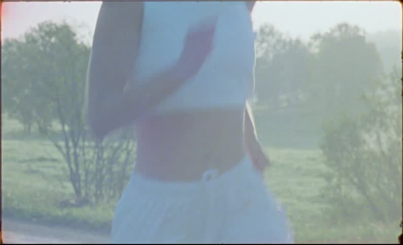 Young fit woman jogging on the countryside at morning