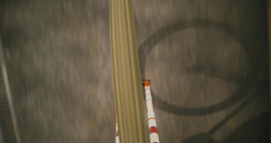 Close up of the wheel of a bicycle driving on a road