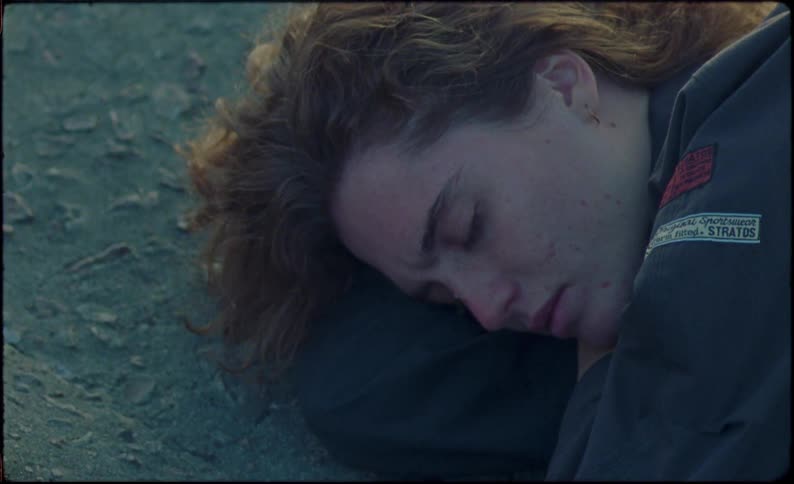 A sad young woman lying on the floor