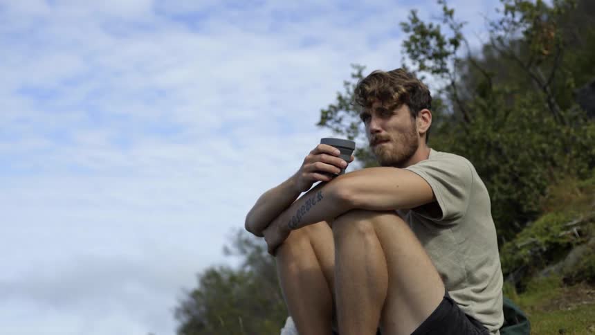 A thoughtful explorer finds a moment of inner peace during a solo wilderness expedition.