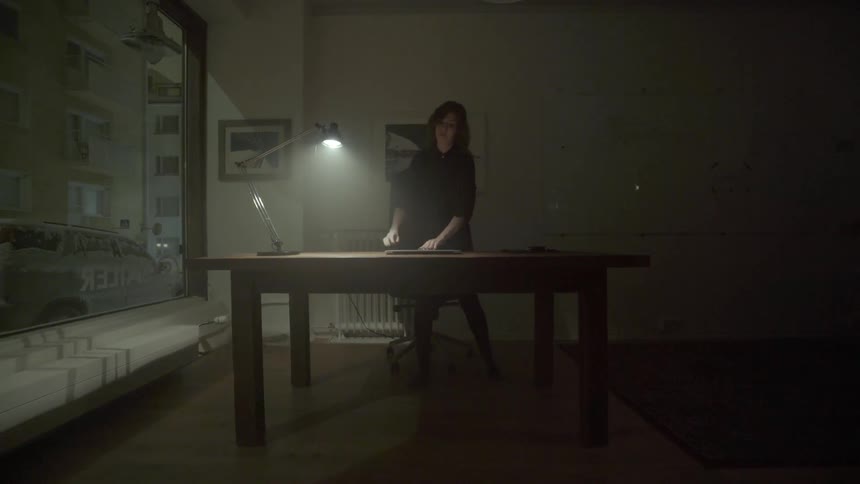 A creative freelancer sets up her digital workspace to capture sudden nighttime inspiration.