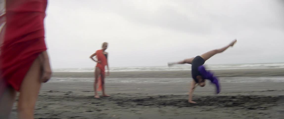 Young sisters bond and enjoy an adventurous afternoon of creative play by the sea.