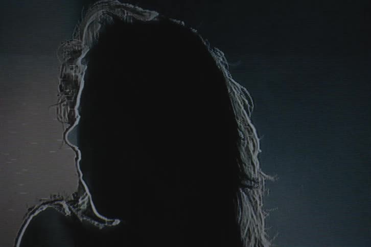 The light flashes on the woman briefly