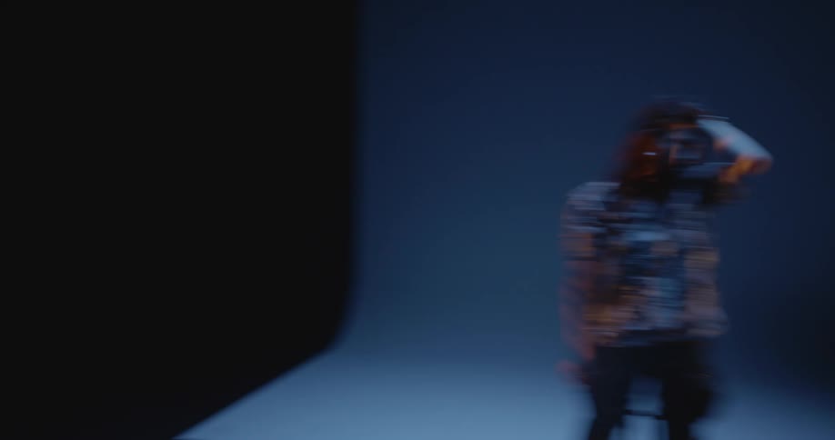 Chaotic shot of a woman modeling in a studio