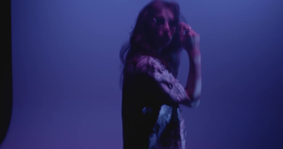 Chaotic shot of a woman modeling in a studio