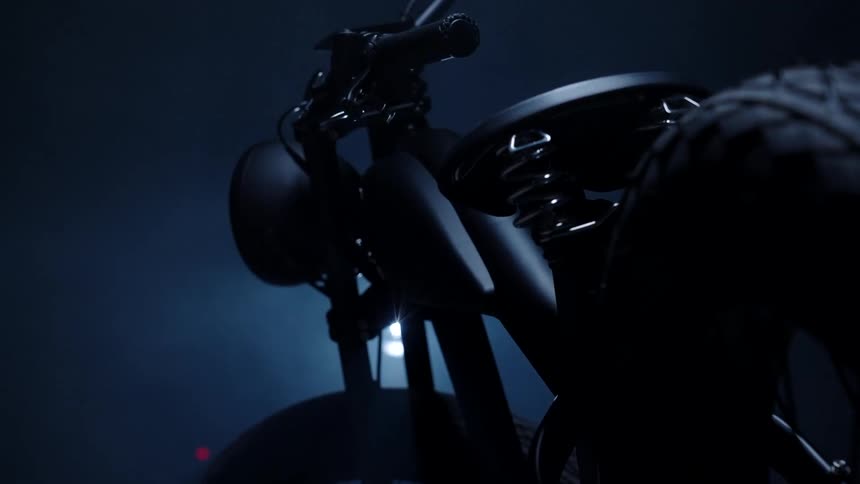 Close up of a dark bicycle inside a room