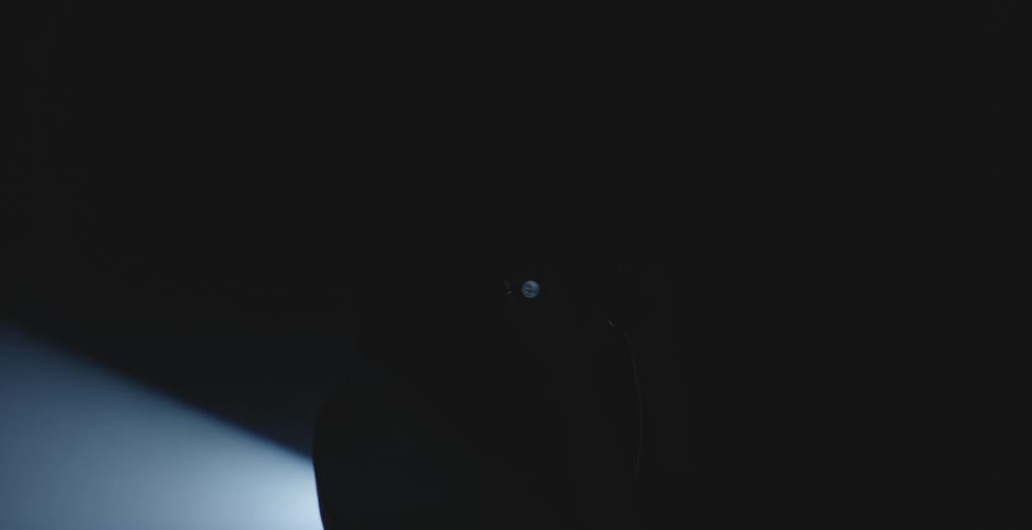 A sad woman in a dark room