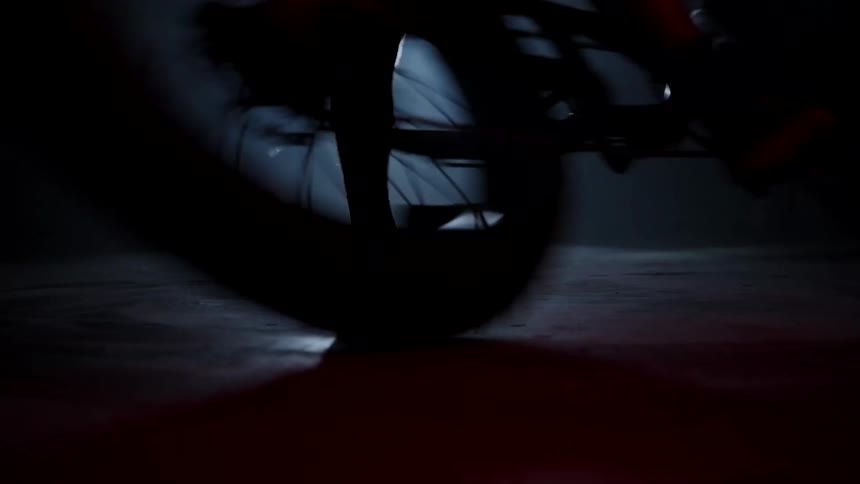 A person is spinning his bike around