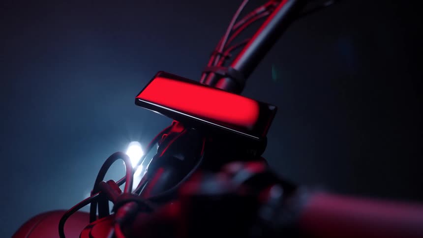 Device attached to a bicycle handlebar under red lights