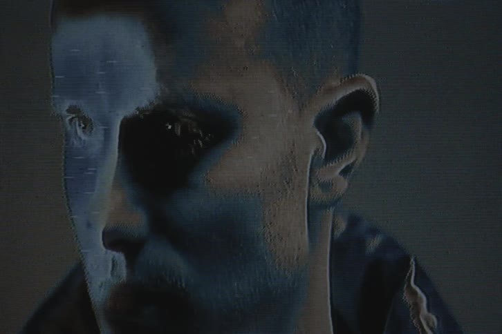 Face of a man modeling with vhs video distortion