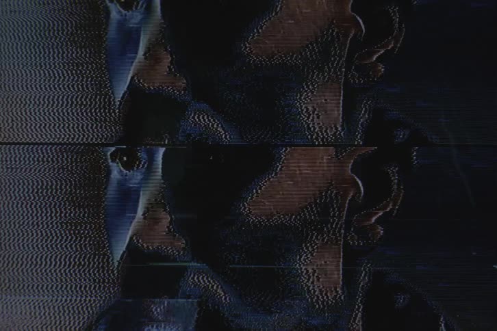 Close up of the face of a handsome man shot on vhs