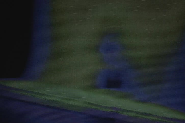 Shaking confusing footage of a model with vhs distortion