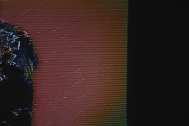 Man modeling clothes on a distorted vintage television screen