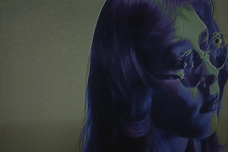 Closeup of a womans face wearing sunglasses