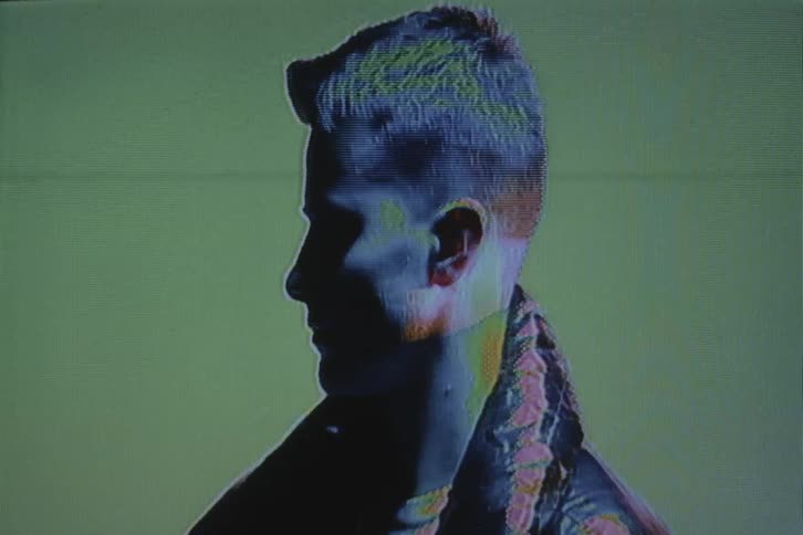 The man is standing in the shadow