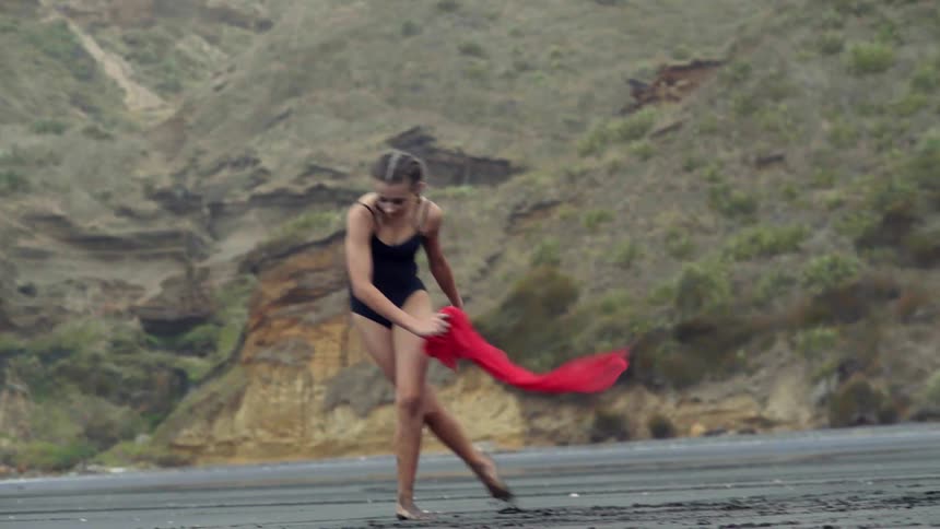 A passionate young performer starts dancing along a desolate coastline to express her freedom.