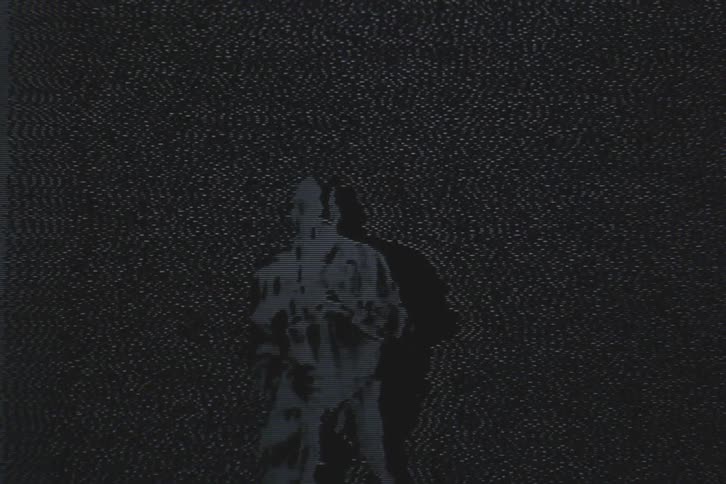 A man is dancing while covered in static