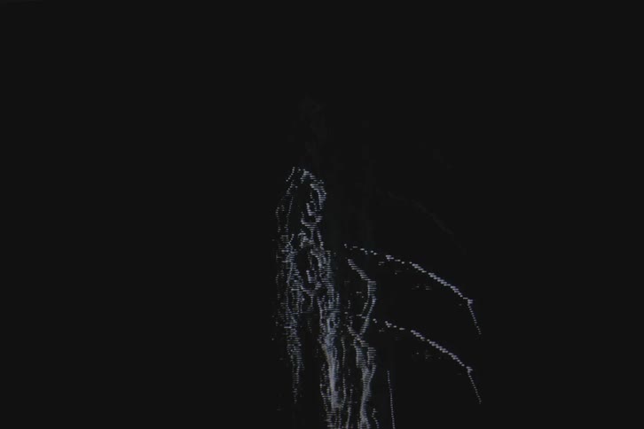 Silhouette of a woman in front of a spotlight on vhs video distortion