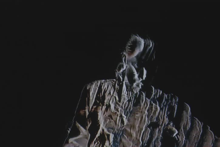 A man is doubled in the blurry image
