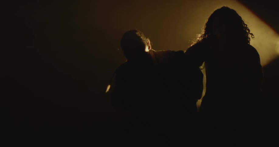 People dancing in a dark room