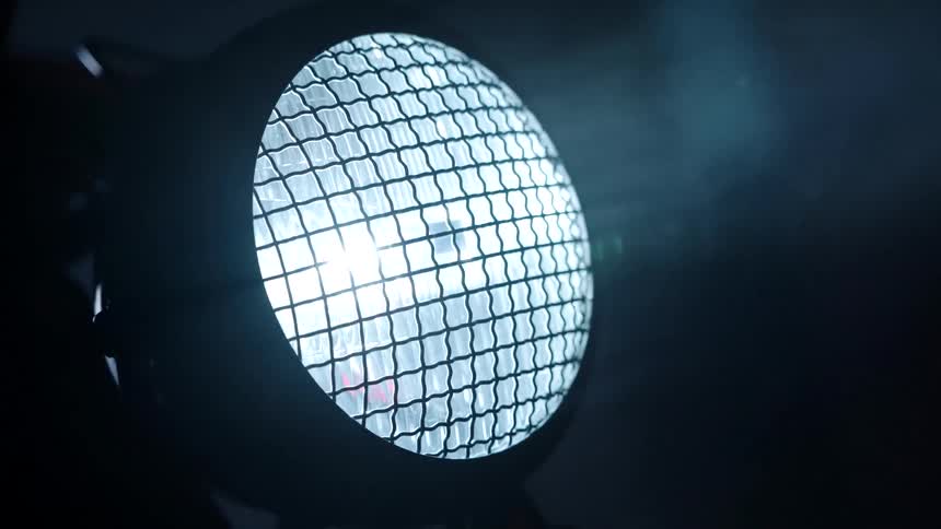 The headlight shines in the mist