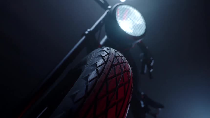 Close up of the tire and headlight of a bicycle