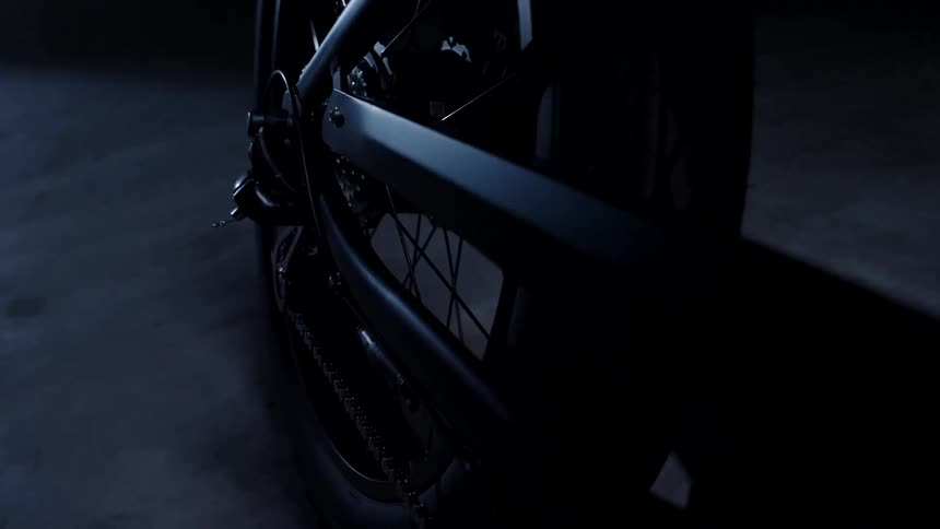 A tire is in the dark garage