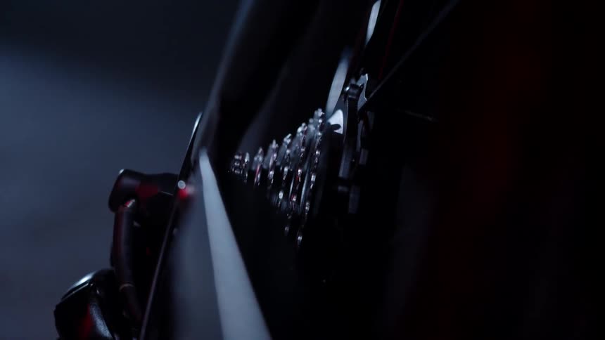 A bicycle is in the dark