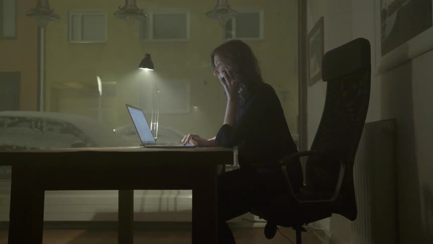 A remote business professional manages an unexpected client emergency during an overnight shift.
