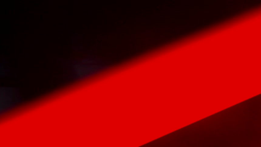 Chaotic footage of a bicycle under red lights
