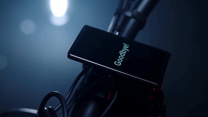 Screen reading goodbye attached to a bicycle handlebar