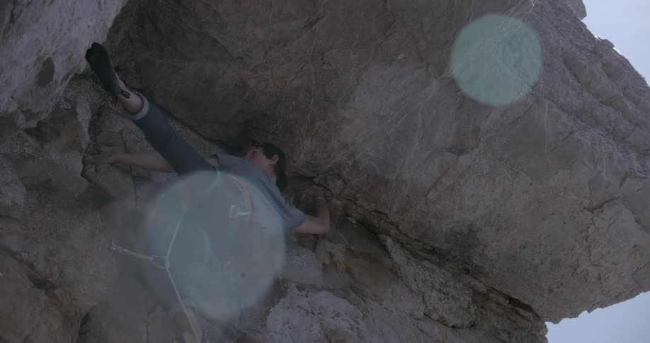 A man climbing a rocky mountain