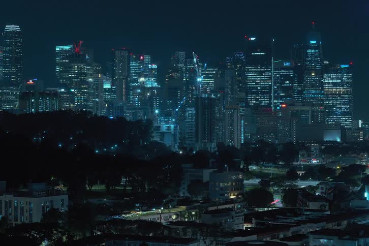 The time lapse shows construction of tall buildings at night