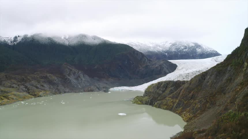 Aerial view of a glacier in the mountains of Alaska