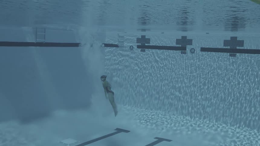 Olympic athlete dives into a pool