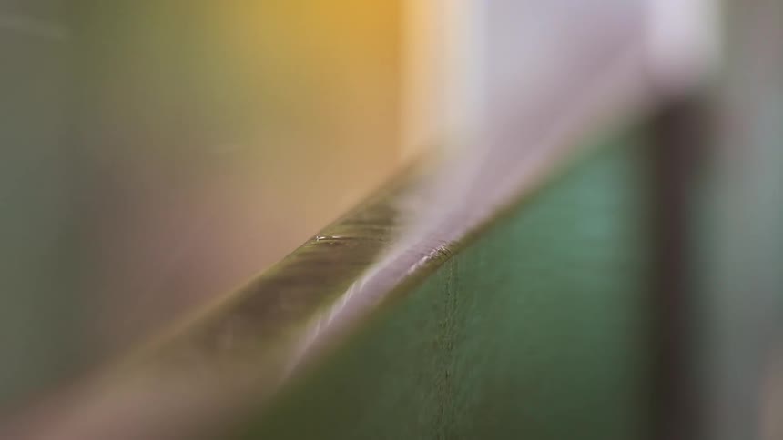 Rain drops splashing over an edge