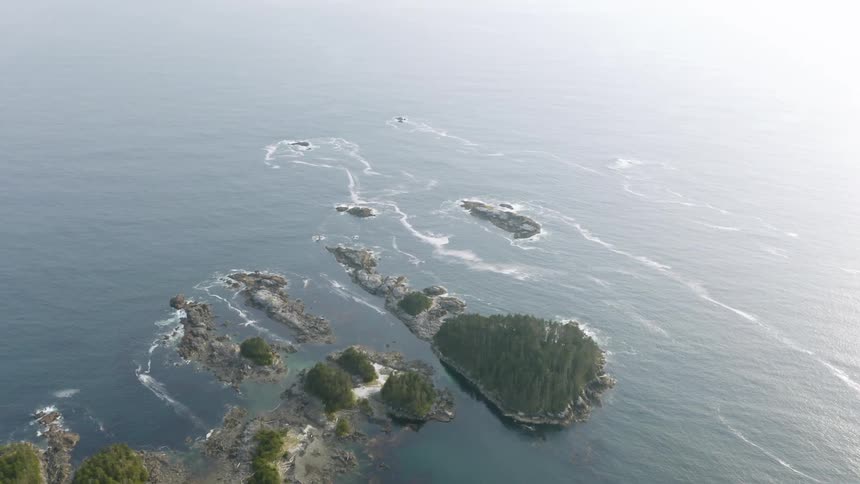 Aerial of forest covered coastal land and nearby islands in the Tongass National Forest Alaska