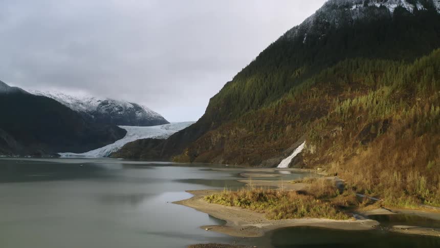 Aerial view of a glacier nested in the mountains