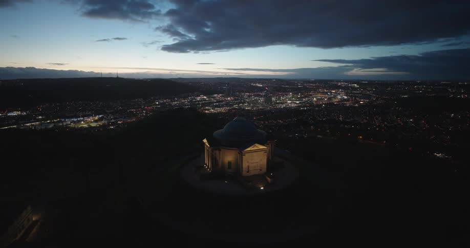 A church is on a hill before the city